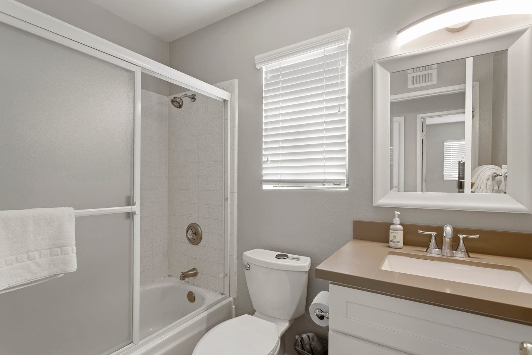 Bathroom with shower tub combination and vanity