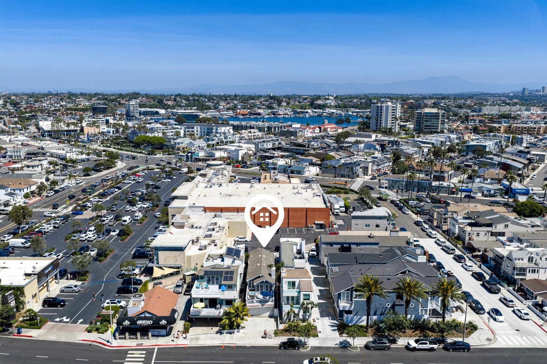 Aerial neighborhood view of West Newport Beach and nearby shopping
