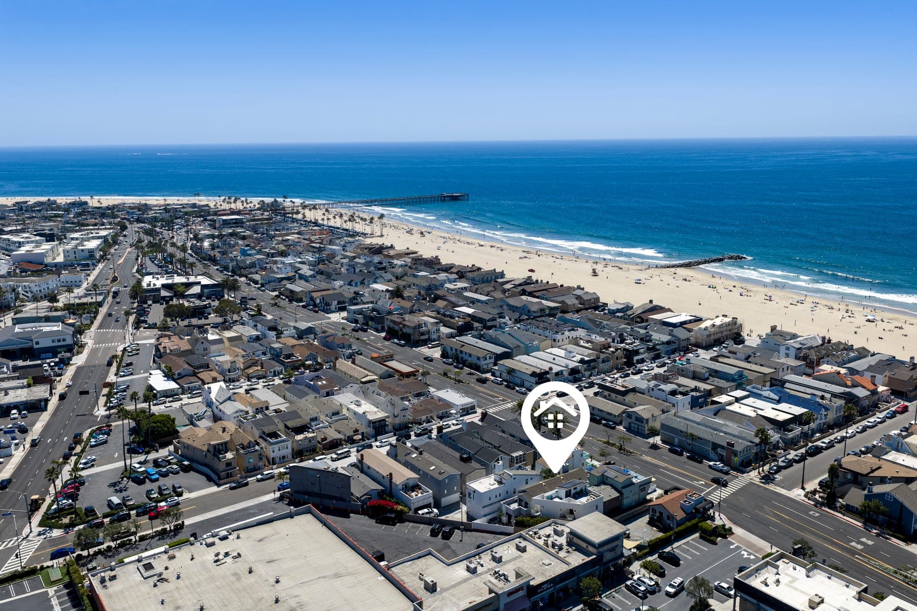 Wide Newport Beach coastline aerial with nearby neighborhood streets