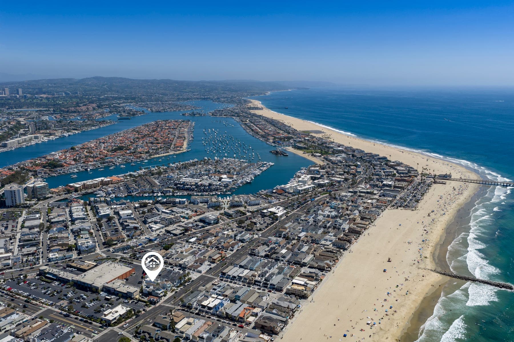 Aerial view of the Balboa Peninsula, beach, harbor, and Newport coastline