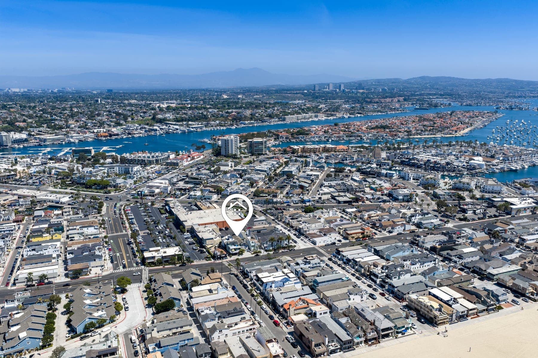 Aerial view of Balboa Peninsula, harbor, beach, and surrounding coastline