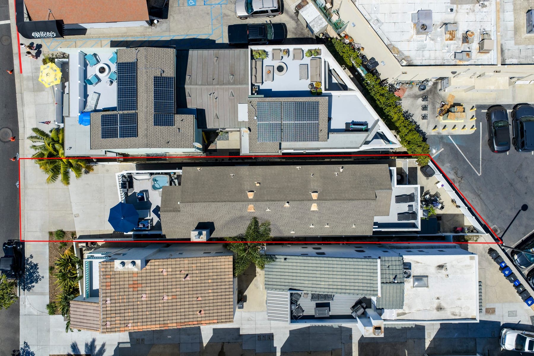 Overhead aerial view of the property and surrounding homes