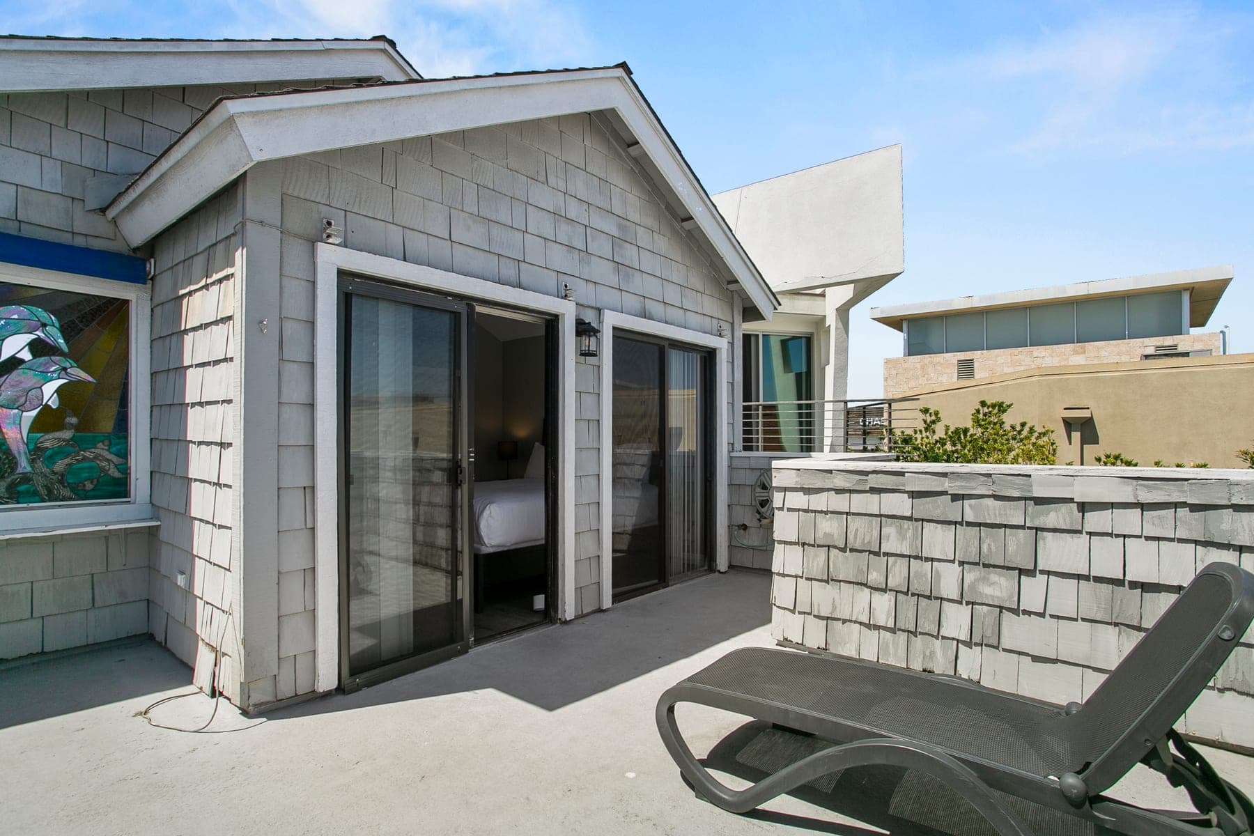 Roof deck with lounge chairs and neighborhood views