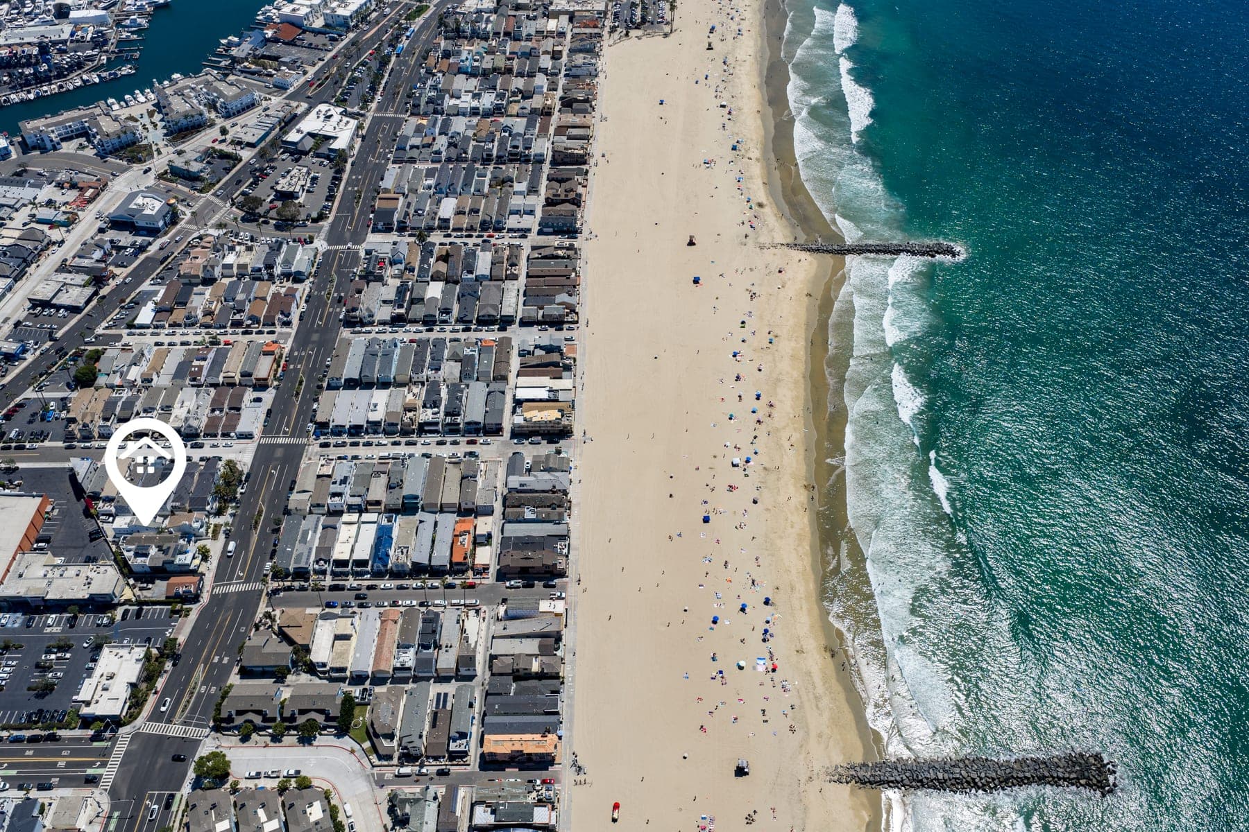 Aerial beach view with location marker near Newport Beach Retreat