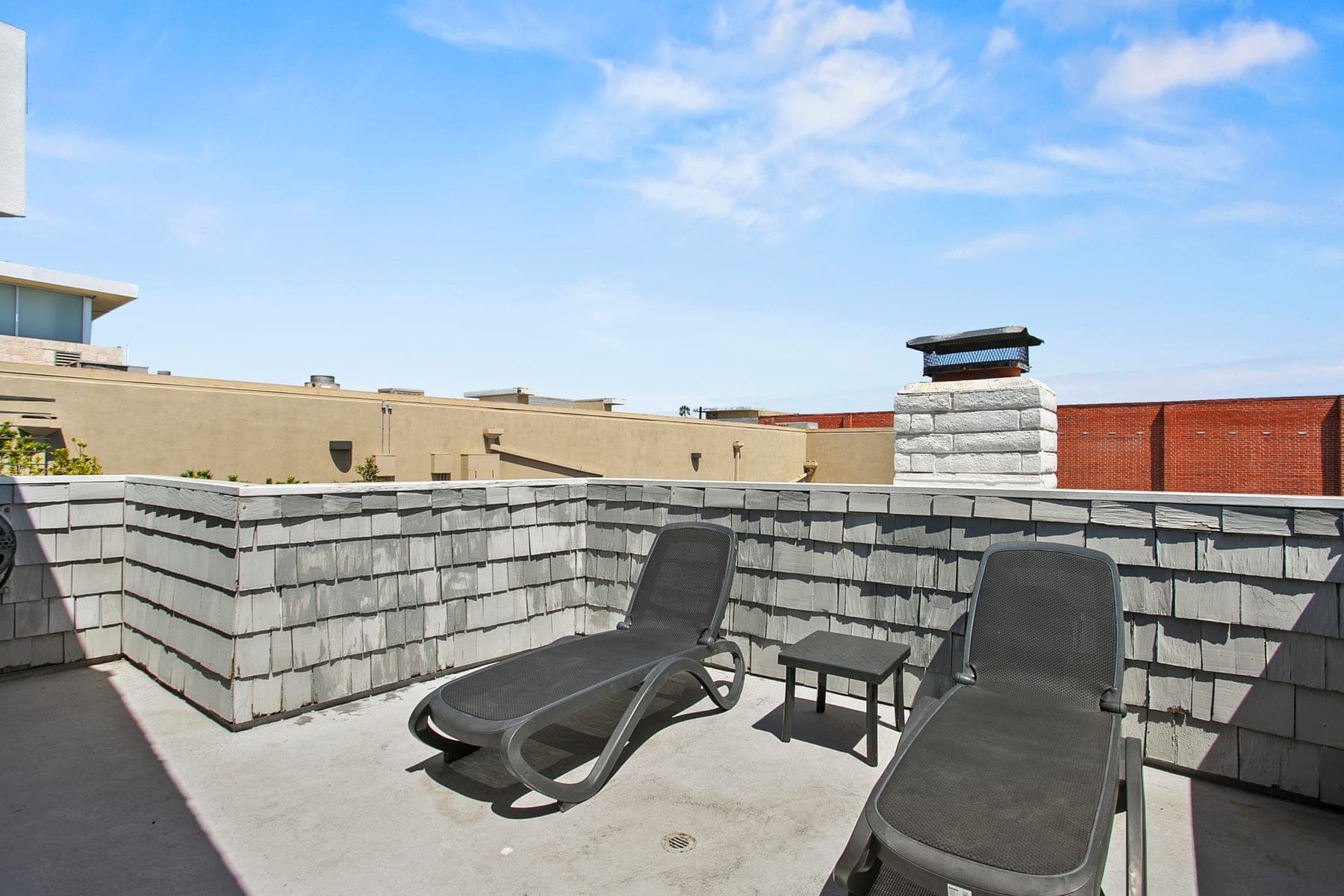 Sun deck with lounge chairs and open sky